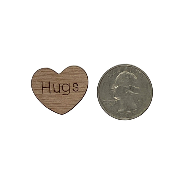 1 inch wood hearts with the word Hugs on them confetti