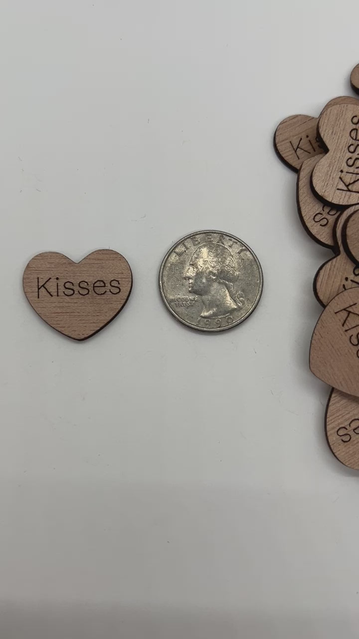 1 inch wood hearts with the word kisses on them confetti